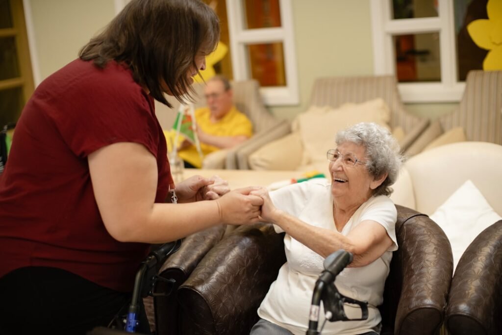 Care worker supporting an older adult at home