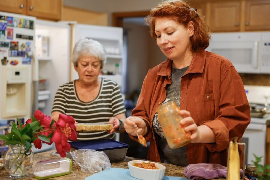 Two people preparing food together as part of everyday living support